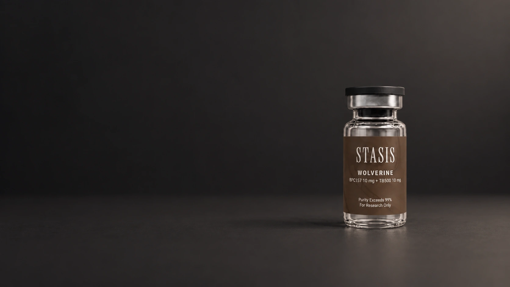 Stasis Wolverine vial with a brown label photographed on a charcoal studio surface